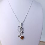 Amber cat and sterling silver pendant